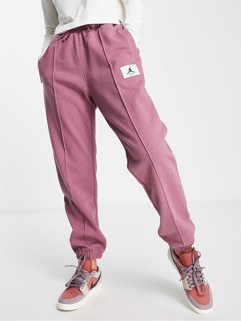 Jordan Women's Essentials Fleece Jogger Pants in a mauve